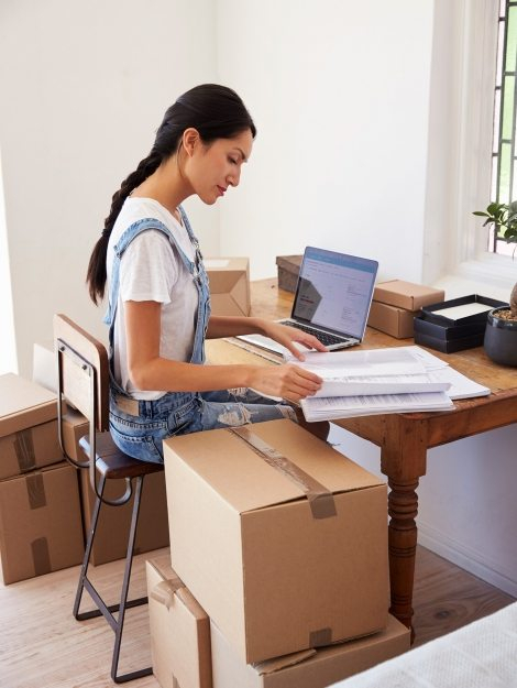 woman-running-business-from-home-working-on-PCZKTN9-470x625